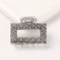 Detail view of rectangular hollow metal hair claw clip with crushed silver texture finish - Rectangle - Antique Silver