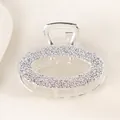 Detail of silver alloy hair claw clip featuring elegant rose embossed floral patterns - Oval - Silver