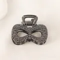 Macro detail of dark grey bow hair claw clip with intricate rose flower embossment - Bowknot - Gun Black