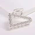 Close-up of silver triangle hair claw with textured metallic finish and glittery surface - Triangle - Silver