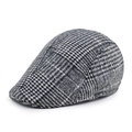 Classic black and white houndstooth wool newsboy cap shown from a 45-degree angle - Grey-White Plaid