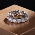 Close-up of eternity ring with heart and rectangle zircons on brushed metal stand - US 6 / Silver