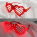 Red heart-shaped LED shutter glasses with glowing lighting effect for party and rave - Heart Shutter / Red