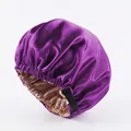 Close-up of double-layer purple satin hair bonnet with adjustable strap and gold lining - Dark Purple