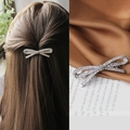 Sparkling silver rhinestone bow hair clip showing model wear and product details - Silver Rhinestone Lady Spring Clip