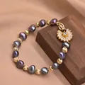 Bracciale di perle barocche viola con perle dorate a righe e ciondolo a petalo lucido - Viola scuro