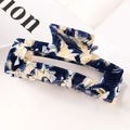 Macro shot of rectangular acetate hair claw with blue and beige marble texture - S118-14 Blue & Beige Ink Pattern
