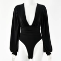 Detail of black deep V-neck bodysuit with long puff sleeves and cinched waist on mannequin - XS / Black