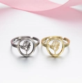 Detail of 18K gold and silver plated stainless steel rings with hollow rose floral designs - 018 (Hollow Rose)