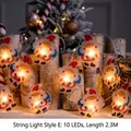 2.3M Christmas LED string lights with 10 Santa Claus figures on wood logs - Classic Santa Claus Style E (10 LEDs / 2.3M)