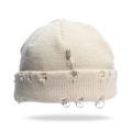 Cream knit beanie featuring silver safety pin and metal ring accents in punk style - One Size / Beige