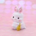 Cute white bunny figurine holding a yellow bottle for car interior or cake decoration - Mini Rainy Day Rabbit Style