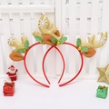 Close-up of glitter gold reindeer antlers headbands with small bells and festive decor - Elf Antlers / Gold/Red