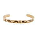Golden stainless steel cuff bracelet with Black Lives Matter engraving and fist icon - Cuff Bracelet / Gold Black Lives Matter