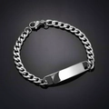 Macro detail of silver stainless steel Cuban link bracelet with a blank rectangular bar - 1:1 NK Chain / Steel