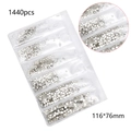 Macro detail of 1440pcs white glass nail rhinestones in 6-grid pack with cut surface - Silver Bottom White
