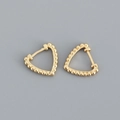 Detailed macro view of S925 sterling silver triangle hoop earrings with gold bead texture - Triangular Beaded Style / 925 Silver / Yellow Gold Color (Pair)