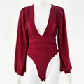 Detail of burgundy deep V-neck bodysuit featuring lantern sleeves and waist pleats - S / Burgundy