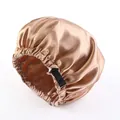 Detail of champagne satin sleep cap with adjustable black elastic buckle strap - Khaki
