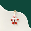 Detailed macro shot of gingerbread man earrings with gold star pendant and red details - No.15 Gingerbread Man Stud Earring (Single)