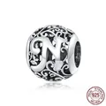 Polished S925 sterling silver hollow sphere charm with letter N and floral patterns - 925 Silver / Letter N