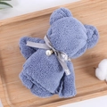 Blue-purple coral fleece towel folded into a bear with a pearl and ribbon - Grey Blue (30*30)