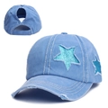 Light blue denim ponytail baseball cap with glittery green star patches and distressed details - Lake Blue