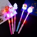 Light-up Christmas magic wand set featuring Santa and Snowman in pastel colors - Christmas Glow Stick