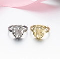 Adjustable stainless steel clover rings in gold and silver finish with pink ribbon decor - 017 (Hollow Clover)