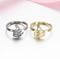 Detailed close-up of gold and silver stainless steel open rings with Christmas tree design - 030 (Christmas Tree)