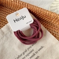 Burgundy high-elastic hair bands set on a display card over a rustic woven background - 6 Pcs Per Card / Bean Paste (8344G)