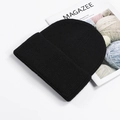 Classic black ribbed knit beanie with cuffed edge for winter outdoor warmth and comfort - Black