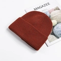 Thick knitted beanie in rust red with rolled edge for winter warmth and comfort - Rust Red