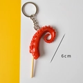 Realistic octopus tentacle food pendant with red suckers and 6cm size indicator - Squid Tentacles Skewer