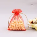 Detail of red organza jewelry bag with gold foil star and moon pattern and drawstring - 7*9cm / Red