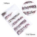 Detailed view of 1440pcs multi-faceted AB crystal rhinestones in a 6-compartment storage bag - Rainbow Rose Gold