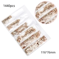 Flat lay of 1440pcs gold glass nail art rhinestones in compartmentalized packaging - Amber