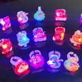 Colorful LED Christmas rings featuring Santa, snowman, and tree designs on dark background - Christmas Soft Rubber Ring Light (Mixed Styles)