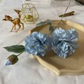 Detailed view of blue artificial peony with three heads on a ceramic tray home decor - Blue