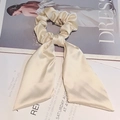 Elegant champagne silk bow hair tie with long ribbons for a stylish ponytail look - Off-white