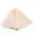 Close-up of soft beige knit bucket hat texture in plush faux rabbit fur material - M (56-58cm) / Beige