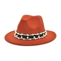 Detail of burnt orange wool fedora featuring black woven band with white pearl accents - M (56-58cm) / Caramel color