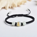 Handmade woven black rope bracelet featuring luminous white beads with a golden snake pattern - Black Rope [Snake]