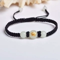 Handmade black woven zodiac bracelet with white jade beads and golden ox charm detail - Black Rope [Pig]