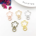 Moschettoni a girello in metallo a forma di fiore nei colori oro rosa, argento e bronzo - Fiore 23x34mm