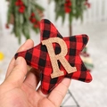 Star-shaped Christmas tree hanging decoration in red and black plaid with jute letter R - Star