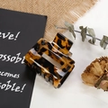 Macro detail of tortoiseshell acetate claw clip with a hollow rectangular design - 5# Hollow Amber Tortoise