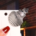 Polished silver shell hair clip featuring realistic scallop textures on a display card - Three Shells / Silver