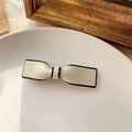 Elegante fermaglio per capelli a fiocco crema con bordo nero su piatto di ceramica - Piccolo - Beige