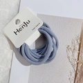 Close-up of blue-grey high-elasticity fabric hair bands on a minimalist card - Gray Blue